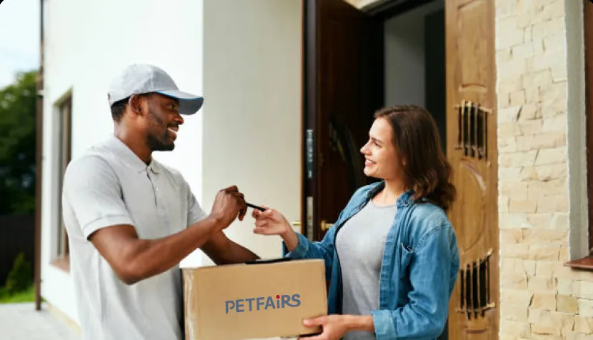 Courier handing a Petfairs parcel to a customer
