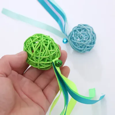 ball toy for cats (2) Made with durable rattan and safe, soft ribbons, this cat toy is built for long-lasting play. The bell adds a sound element, making it ideal for encouraging cats to interact and play independently.