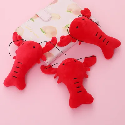 Dog chew toy (3)_1 Featuring a fun lobster design, this toy is visually appealing and entertaining for pets. Pet retailers can market this toy as a must-have for dogs who love to chew and play with engaging, sensory-rich toys.