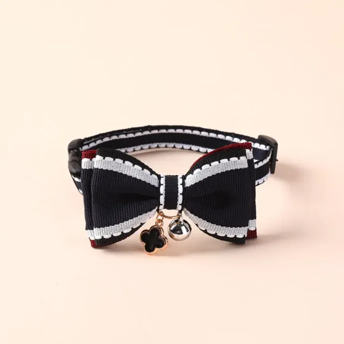 Bow Tie Pet Collar with Bell (5) Fashionable double-layer bow tie pet collar with adjustable length, durable alloy buckle, and charming bell – perfect for small dogs and cats.