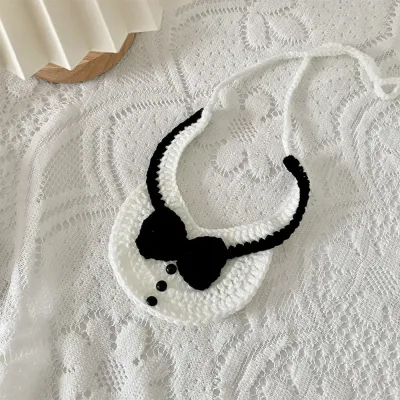The faux bowtie detailing adds a classic, elegant touch to this bib, making it a standout accessory for pets at special events or family gatherings.