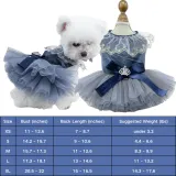 pet wedding dress (1) Designed with a D-ring leash attachment, this dress ensures pets can be safely secured during walks or events while maintaining their fashionable appearance.