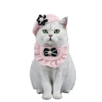 cat hat(2) This complete 1-set Christmas pet outfit includes a knitted bib with a pearl bow and a beret hat, designed to keep pets stylish and cozy during the holiday season.