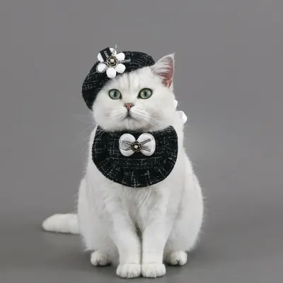 dog hat (3) This cat knitted bib or beret hat with a 3D floral bowknot offers an elegant, stylish accessory for pets, ideal for special occasions or everyday wear.