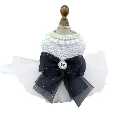 dog clothes pet (5) Featuring an elegant white pearl and black bow accent, this dress blends sophistication with a cute, vintage aesthetic.
