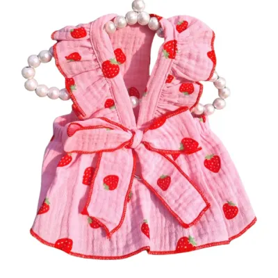 Strawberry print dog dress with bow and leash ring, made from 100% cotton for small dog breeds and cats.