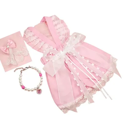 "3-piece pink pet outfit set includes dress, necklace, and hair clip for a complete stylish look."