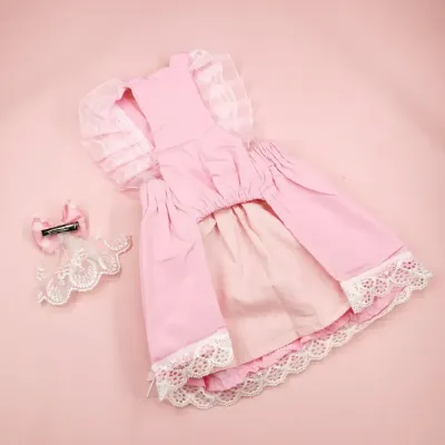 "Coordinated pet outfit in soft pink tones adds elegance to any pet apparel collection."