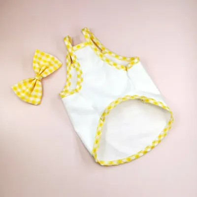 dog clothes dresses (2) "Classic plaid pattern with bow tie for a cute and fashionable pet dress."