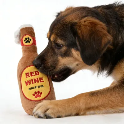 Dog Playing with Red Wine Plush Squeaky Toy dog biting red wine plush squeaky toy interactive chew toy for puppies and small dogs