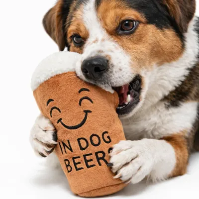 Dog Chewing Beer Plush Squeaky Toy Close Up dog chewing beer plush squeaky toy soft interactive dog toy for teething and play