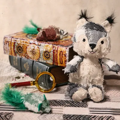 Hippie Series Plush Pet Toy Wholesale Collection A collection of hippie style plush toys including a squirrel and other animal characters displayed on vintage books.