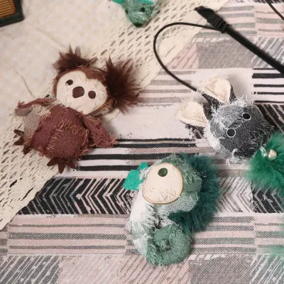 Hippie Series Plush Pet Toy Collection Wholesale Collection of petfairs hippie series plush toys including an owl chameleon and rabbit on a rug.