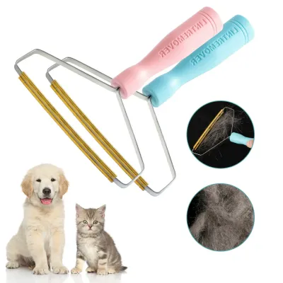 lint-remover-before-and-after-pet-hair Close-up demonstration of the copper scraper removing a thick clump of pet hair from a black fabric surface.