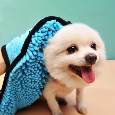 small dog wrapped in blue microfiber pet bath towel for fast drying and grooming