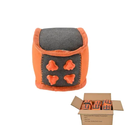 wholesale-squeaky-dice-dog-toys-bulk-packaging A single orange squeaky dice toy shown above a cardboard shipping box filled with bulk pet supplies.