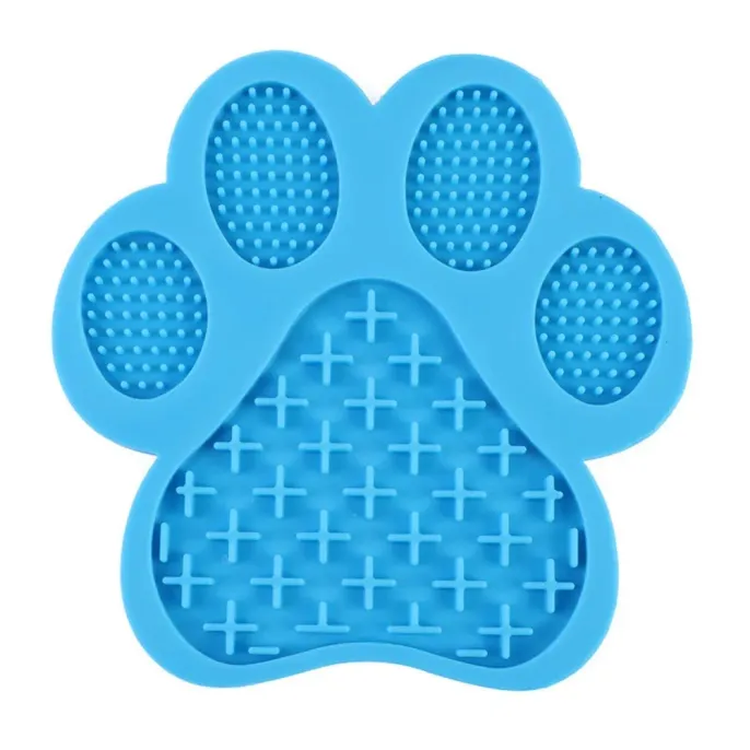 Professional product image of a dark blue paw-shaped slow feeder mat made from food-grade silicone.
