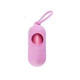 Soft Pink Pet Waste Bag Dispenser A soft pink pill-shaped dog waste bag dispenser with a matching pink clip and bags.