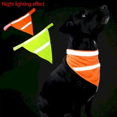 Reflective Dog Bandana Night Lighting Effect A black dog wearing an orange bandana with glowing reflective strips at night, demonstrating low-light visibility.