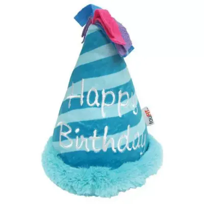 Close-up of a blue striped plush dog hat with white "Happy Birthday" embroidery and pink ribbon topper.
