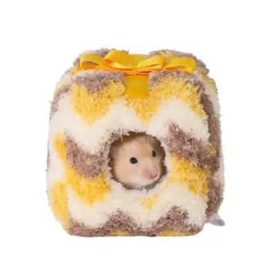 cozy-hamster-warm-bed-yellow A cute hamster peeking out from a yellow chevron pattern plush warm nest.