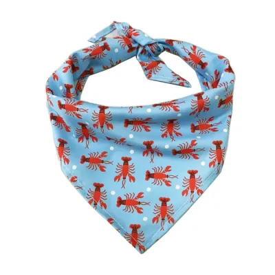 Blue and Red Lobster Pattern Tie-On Dog Bandana A close-up view of a light blue triangular dog bandana featuring a repetitive red lobster and white polka dot print.