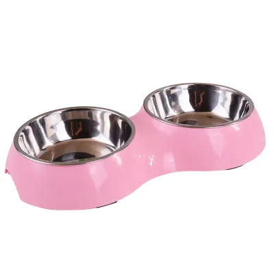 Close-up of a pink double pet bowl with removable stainless steel inserts.