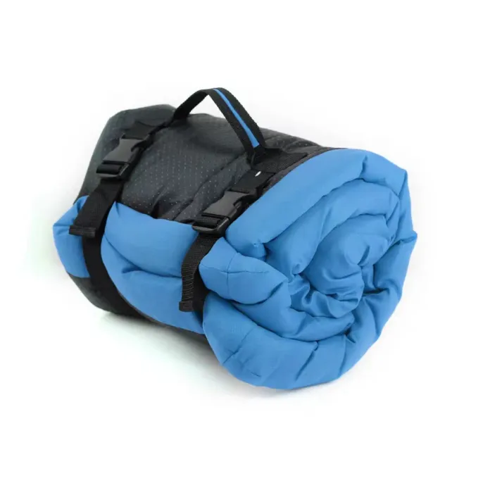 Blue-Portable-Dog-Sleeping-Pad Blue waterproof pet sleeping pad rolled and secured with straps for easy travel and storage.