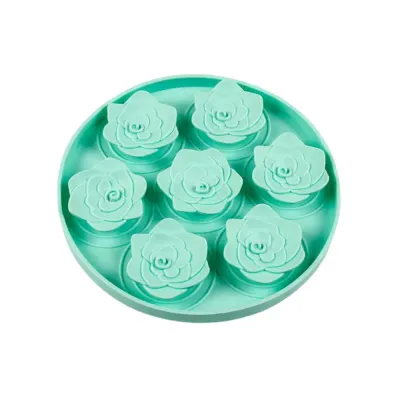 Mint Green Succulent Silicone Dog Lick Mat High-angle shot of a mint green silicone dog slow feeder featuring seven succulent-shaped raised patterns.