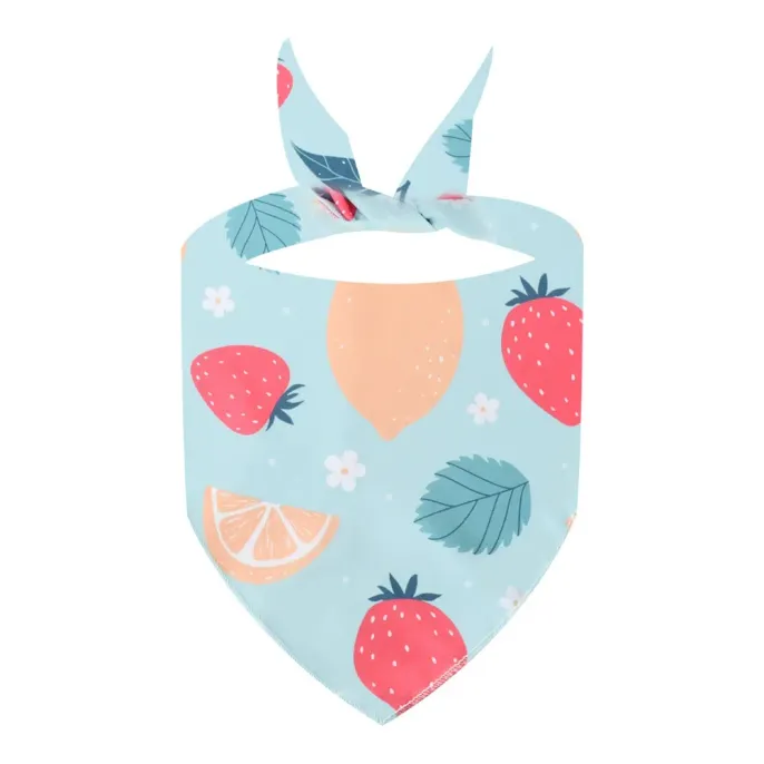 blue-strawberry-and-peach-dog-bandana Close-up of the "Blue" dog bandana featuring red strawberries, peaches, and white flowers on a sky-blue background.
