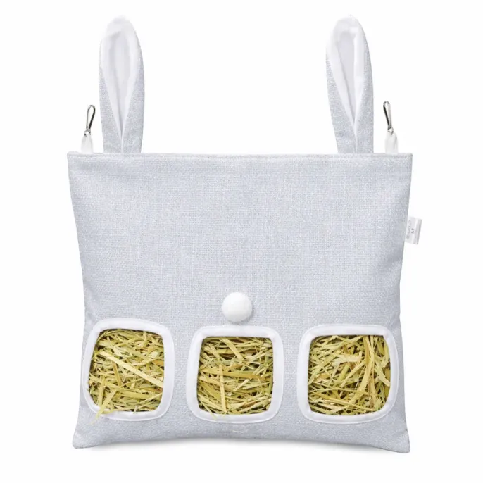 Front view of a light blue-grey hay feeder bag with decorative bunny ears and metal clips.