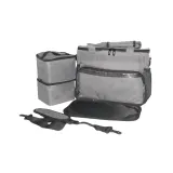Isolated view of the grey pet travel organizer with stacked food containers and adjustable carry strap.