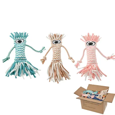 multi-color-octopus-style-cotton-rope-dog-toys Three octopus-shaped braided cotton rope dog toys in turquoise, brown, and pink displayed next to a shipping box.