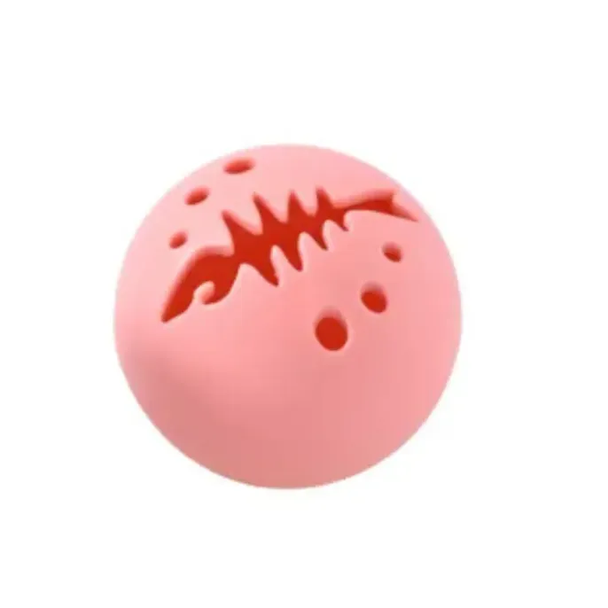 pink-fish-bone-cat-toy-ball Close-up of the pink interactive cat toy ball with fish-bone shaped ventilation holes for scent dispersion.