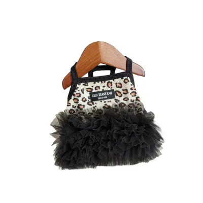 Leopard Print Puppy Tutu Dress on Hanger Leopard print puppy suspender dress with black layered tutu skirt displayed on wooden hanger
