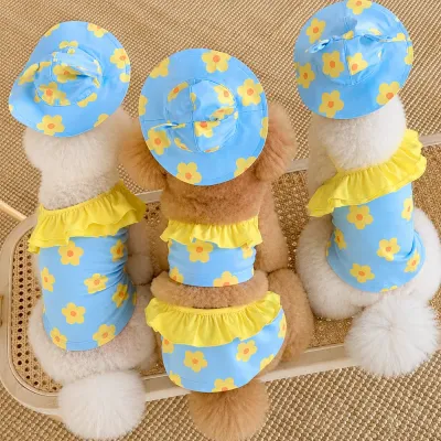 Blue Floral Dog Swimsuit Back View | Petfairs Three dogs wearing blue flower print dog swimsuits with yellow ruffles and matching hats