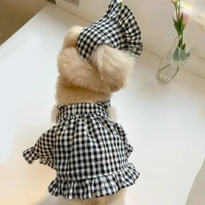 Back View of Plaid Dog Dress with Matching Hat | Petfairs Rear view of small dog wearing a black plaid pet dress and matching bonnet