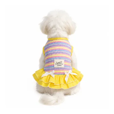 Rainbow Striped Dog Dress for Small Dogs Back View | Petfairs Small white dog wearing pastel rainbow striped summer dog dress with yellow ruffle skirt and bow details