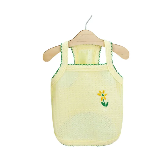 Yellow Daisy Summer Clothes for Small Dogs Bright yellow mesh dog tank top with a yellow daisy embroidery and dark green scalloped trim.