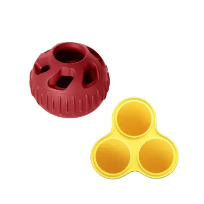 Red silicone dog treat ball with reusable frozen snack mold for interactive pet feeding