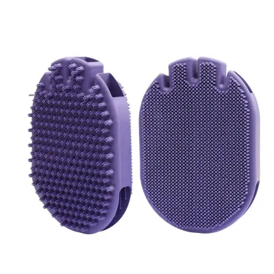 Purple soft silicone pet grooming brush with textured massage side and cleaning side isolated on white background