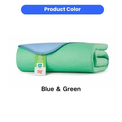 Folded blue and green washable pet underpad with soft quilted surface and absorbent design