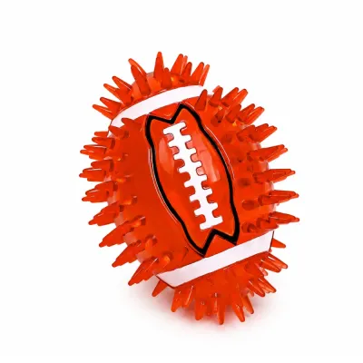 Red TPR Rugby Dog Toy for Interactive Chewing Red rugby shaped squeaky dog chew toy with textured spikes for aggressive chewers