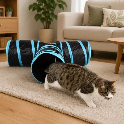 Indoor cat playing inside a blue foldable cat tunnel toy in a modern living room setting