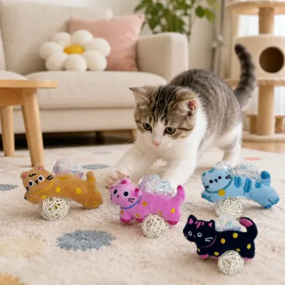 Adorable kitten playing with colorful plush silvervine bell rattan ball cat toys in a cozy living room