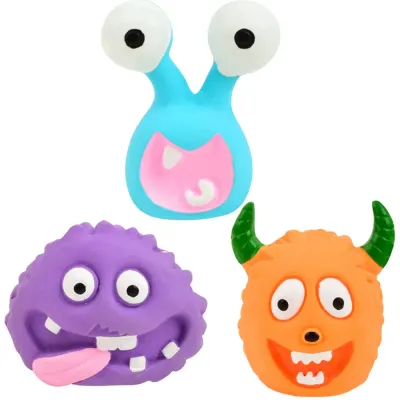Alien Monster Squeaky Latex Dog Toys for Puppies and Small Breeds Pink alien latex squeaky dog toy displayed with purple and orange monster dog toys for puppies