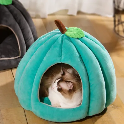 Blue Pumpkin Plush Cat Cave Bed with Sleeping Cat Blue pumpkin-shaped plush cat bed with comfortable enclosed sleeping space for cats