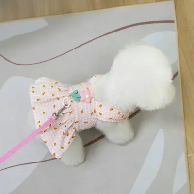 Pink Floral Dog Dress for Small Breed Dogs Small white dog wearing pink floral plaid dog dress with leash attachment