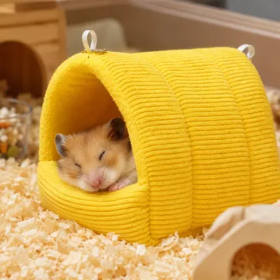 Sleeping Hamster in Warm Hanging Bed Small Animal Nest Cute hamster sleeping inside a soft warm hanging pet bed designed for winter comfort and security