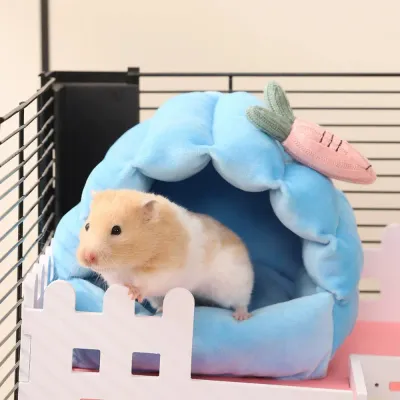 Cute hamster resting inside a soft plush small pet bed in a cage environment